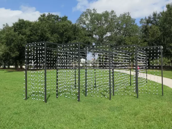 Modern building with large windows, fascinating Peruvian and Costa Rican objects, and sculpture garden in Loch Haven Park.