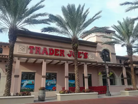 Italian-style shopping center with Publix supermarket, Starbucks coffee, Huey Magoo's Chicken, and Barnes and Noble Bookstore.