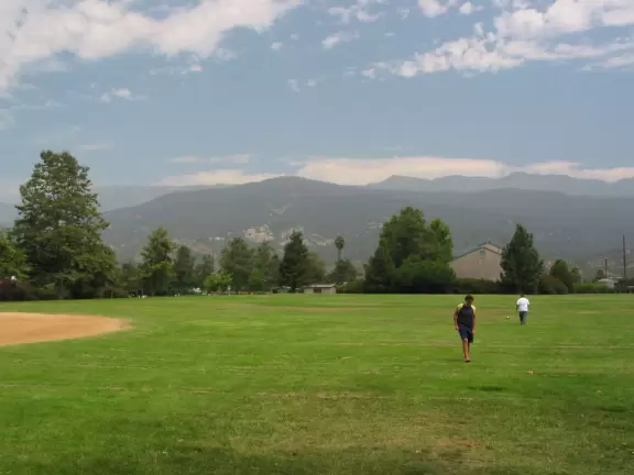 Gorgeous mountain panorama, playground with four large slides, swings, grassy knolls, and plenty of shade.