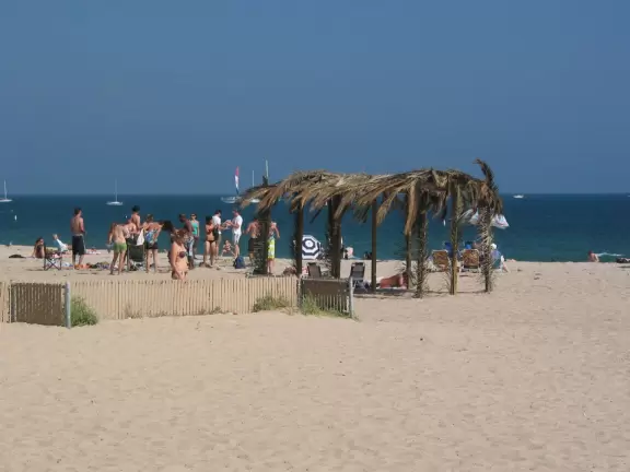 A wide sandy beach that's fun for kids! Wonderful for a long walk around the red cliffs.