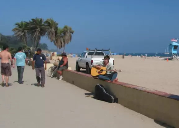 A wide sandy beach that's fun for kids! Wonderful for a long walk around the red cliffs.