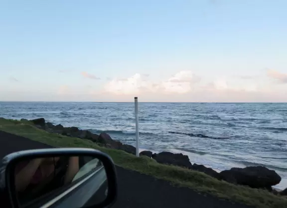 A winding road past pretty beaches, ending in La'ie (Laie), site of the Mormon temple.
