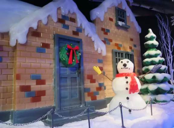 Hotel inside a giant atrium with tropical plants, fish, alligators, and decorations. ICE sculpture event in December.