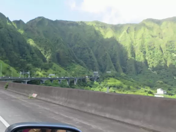 Birdseye views over the windward side from a freeway tucked into the Koolau mountains.