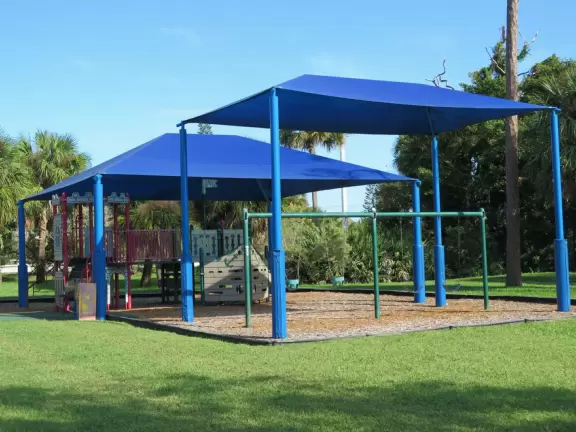 Cute park with covered playground on a canal.
