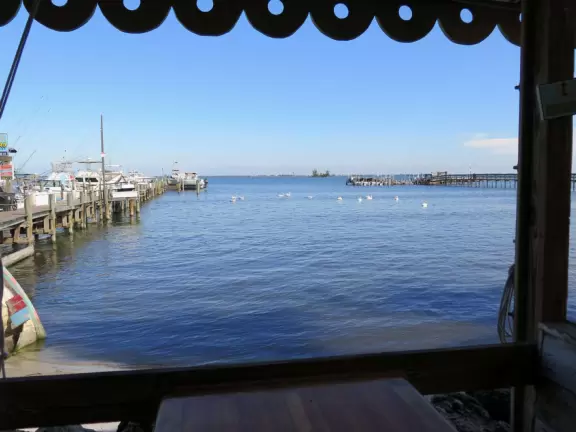 Park with shade, small playground, splash pad, and pier on the intracoastal.