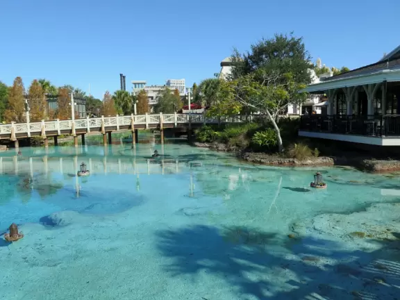 Waterfront area with restaurants, live street performers, entertainment, toy stores, and carousel.