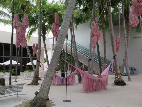 Beautiful architecture, sculptures, modern art museum, designer stores, play equipment, and public market with swings.