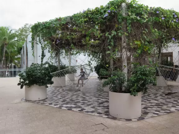 Beautiful architecture, sculptures, modern art museum, designer stores, play equipment, and public market with swings.