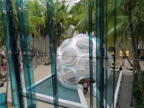 Beautiful architecture, sculptures, modern art museum, designer stores, play equipment, and public market with swings.