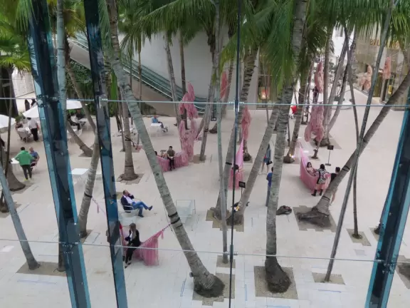 Beautiful architecture, sculptures, modern art museum, designer stores, play equipment, and public market with swings.