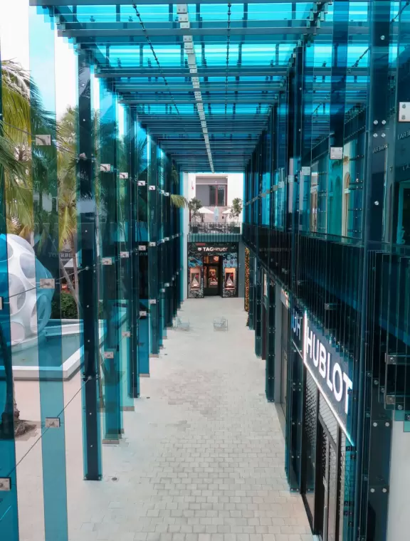 Beautiful architecture, sculptures, modern art museum, designer stores, play equipment, and public market with swings.