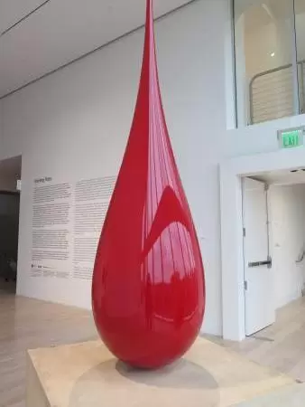 Beautiful architecture, sculptures, modern art museum, designer stores, play equipment, and public market with swings.