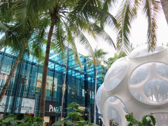 Beautiful architecture, sculptures, modern art museum, designer stores, play equipment, and public market with swings.