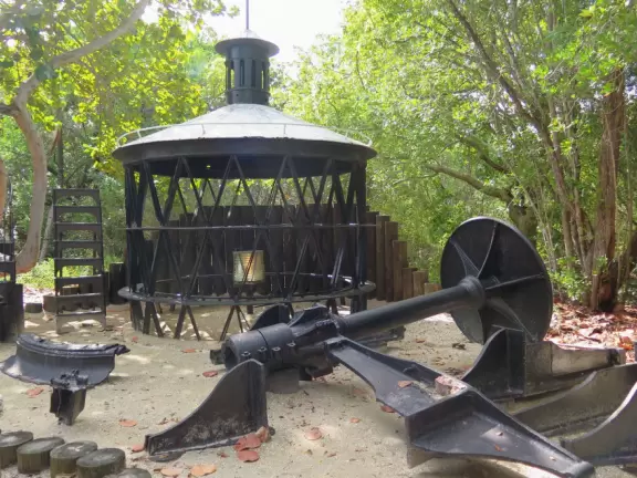 White lighthouse with blue-green water behind- a gorgeous sight! And easy to climb!