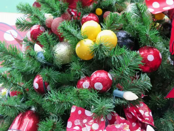 Waterfront area with restaurants, live street performers, entertainment, toy stores, and carousel.