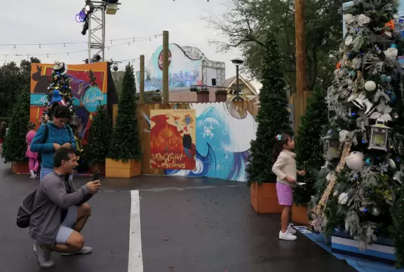 Waterfront area with restaurants, live street performers, entertainment, toy stores, and carousel.