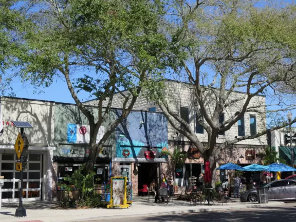 Lovely main street with many sidewalk cafes and young people.