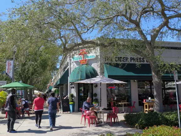 Lovely main street with many sidewalk cafes and young people.