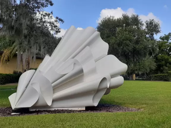 Modern building with large windows, fascinating Peruvian and Costa Rican objects, and sculpture garden in Loch Haven Park.