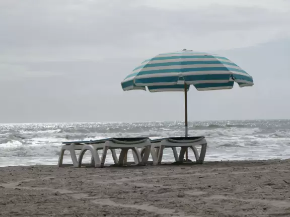 Beach with pretty dunes, slightly grody shoreline, and great walk to jetty.