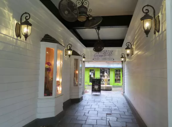 Gorgeous main street with large, European-style park where people sit on the grass by the fountain.