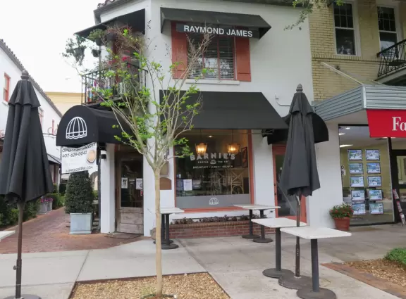 Gorgeous main street with large, European-style park where people sit on the grass by the fountain.