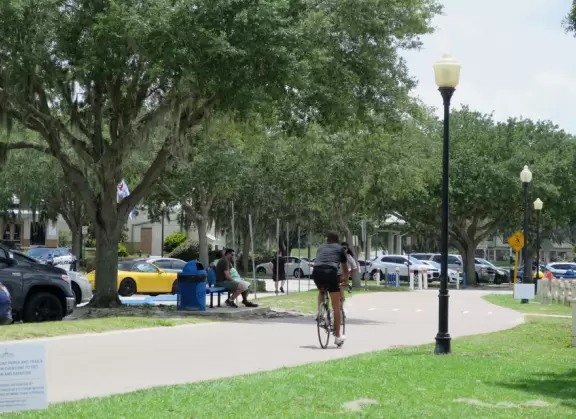 Fun spot on Lake Minneola, with white sand, palm trees, a bike path, a splash pad, and lots of water sports.