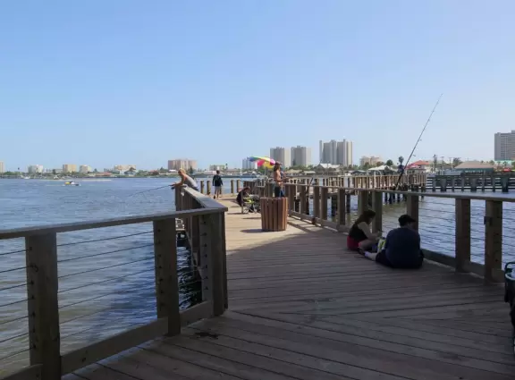 Shady boardwalk to enjoy a breeze off the water.