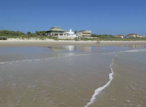 Nice beach with shallow, clear water.