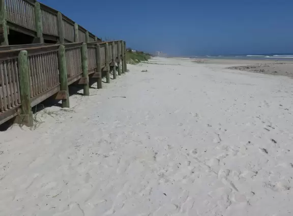Nice beach with shallow, clear water.