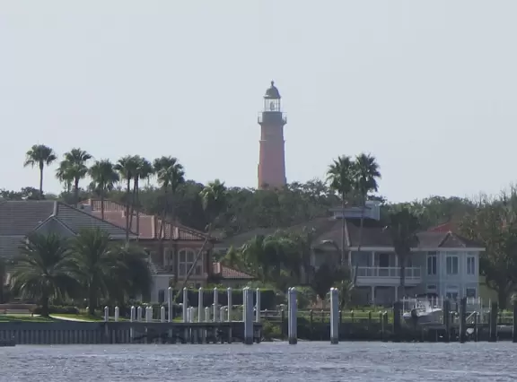 Cute marina where kids can watch boats lifted high by huge forklifts.