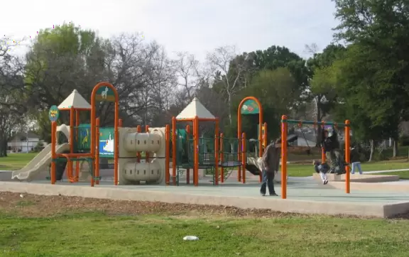 A wonderful neighborhood park with huge oak trees, winding paths, and a super fun new playground.