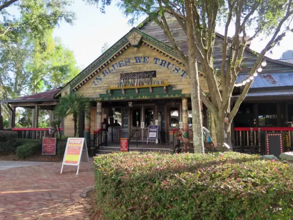 Waterfront area with restaurants, live street performers, entertainment, toy stores, and carousel.