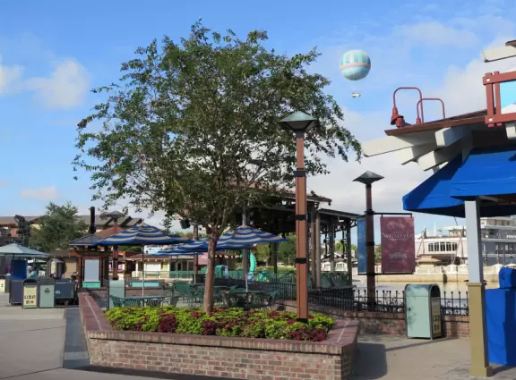 Waterfront area with restaurants, live street performers, entertainment, toy stores, and carousel.