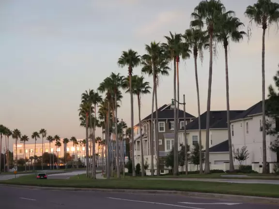Walk along Celebration Blvd at sunset, enjoying the Art Deco buildings.