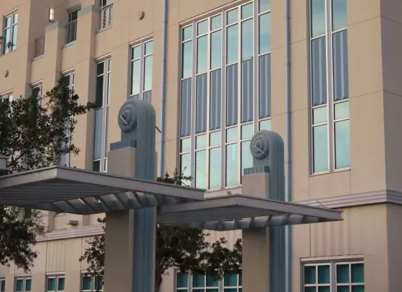 Walk along Celebration Blvd at sunset, enjoying the Art Deco buildings.