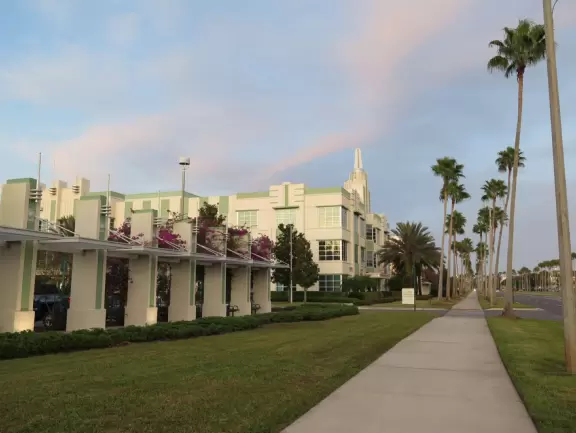 Walk along Celebration Blvd at sunset, enjoying the Art Deco buildings.