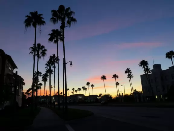 Walk along Celebration Blvd at sunset, enjoying the Art Deco buildings.