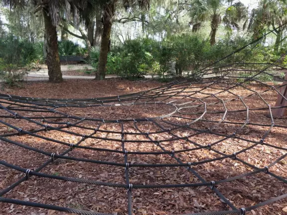 World-class garden with pink marble tower on a pond, giant lily pads, views from up high, and a magical wooded children's area.