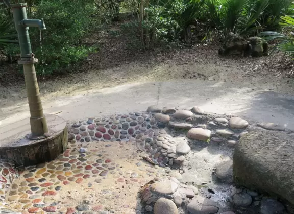 World-class garden with pink marble tower on a pond, giant lily pads, views from up high, and a magical wooded children's area.