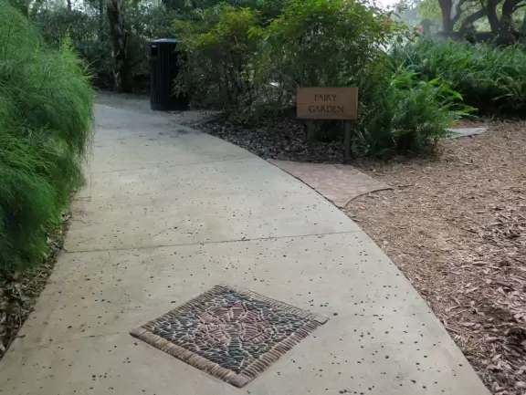 World-class garden with pink marble tower on a pond, giant lily pads, views from up high, and a magical wooded children's area.
