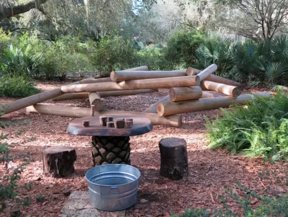 World-class garden with pink marble tower on a pond, giant lily pads, views from up high, and a magical wooded children's area.