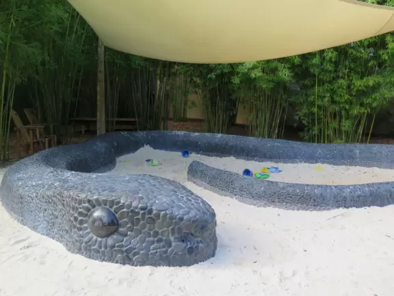 World-class garden with pink marble tower on a pond, giant lily pads, views from up high, and a magical wooded children's area.