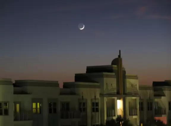Walk along Celebration Blvd at sunset, enjoying the Art Deco buildings.