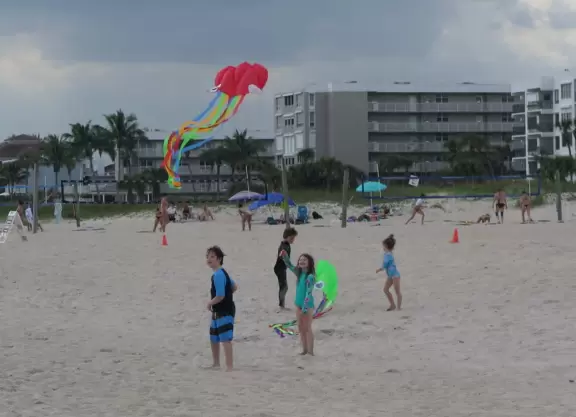Beautiful beach with an abundance of white sand, lifeguards, gazebos in a park before the beach, and a seagrape forest boardwalk to get to the beach.
