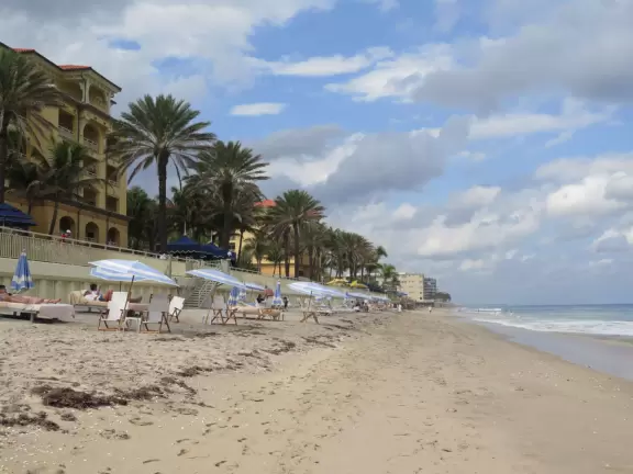 Long, narrow beach with a seawall backed by fancy hotels, a happening feel, and an oceanfront cafe.