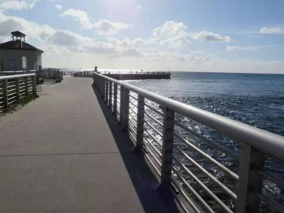 Nice place to park and watch the water rushing in, or stand on the cement jetty and look back at the beach.