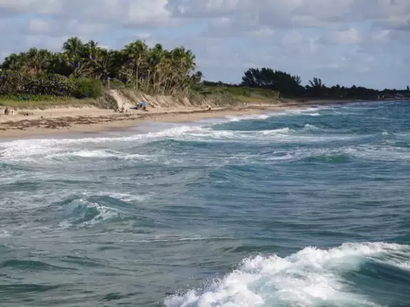 Nice place to park and watch the water rushing in, or stand on the cement jetty and look back at the beach.