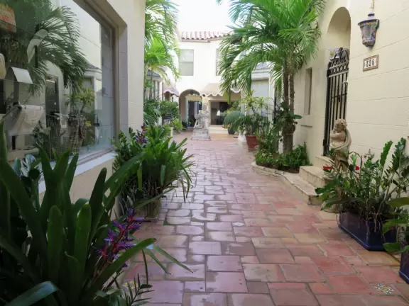 A sumptuous street with Spanish archways and courtyards and unique shops for the extremely rich.